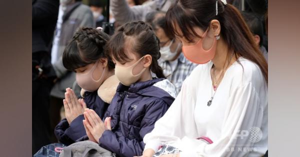 東日本大震災から9年、マスク姿で祈り