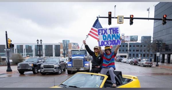 車数千台でコロナ自粛に抗議、米　ミシガン州、「監獄と同じ」