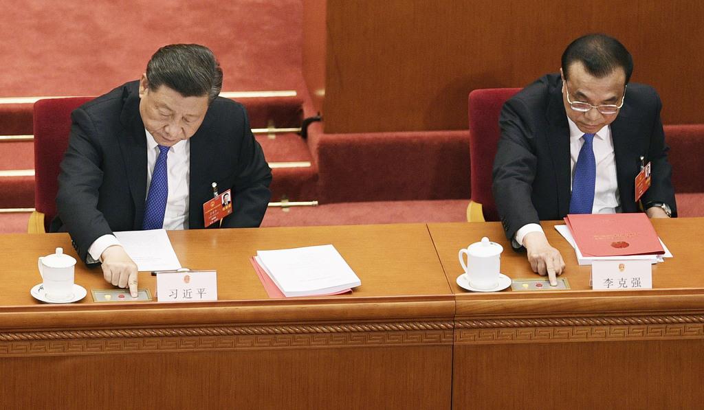 中国、批判覚悟で統制強化へ　香港関連議案採択