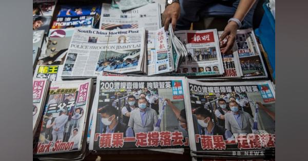 香港紙の創業者逮捕で購入殺到、55万部に増刷 株価は1000％近く急騰