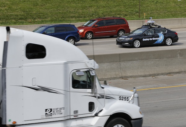 An Acura RLX equipped with autonomous technology travels down Interstate 75 in Detroit.