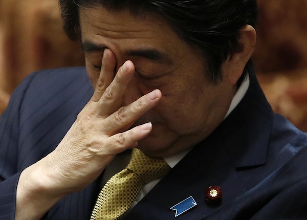 Japan's PM Abe attends a lower house committee session at the parliament in Tokyo