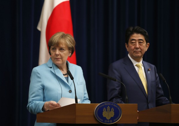 Chancellor Merkel speaks with Japanese PM Shinzo Abe in Tokyo. (Aflo/Reuters)